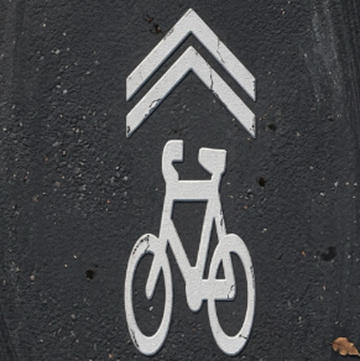 Sharrow: shared lane; cyclists may use the centre of the lane.